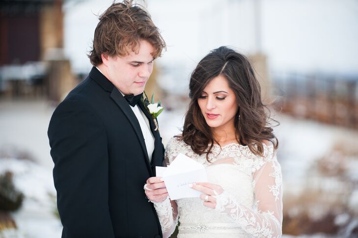 Caleb and his groomsmen sported classic black tuxedos with plain black bow ties for the wedding. Against the stark white snow and vibrant pops of bourdeux, it was a striking look.