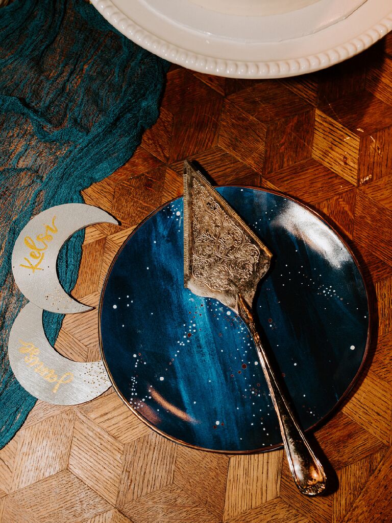 Night sky-inspired serving plates with moon decorations and antique gold serving tool
