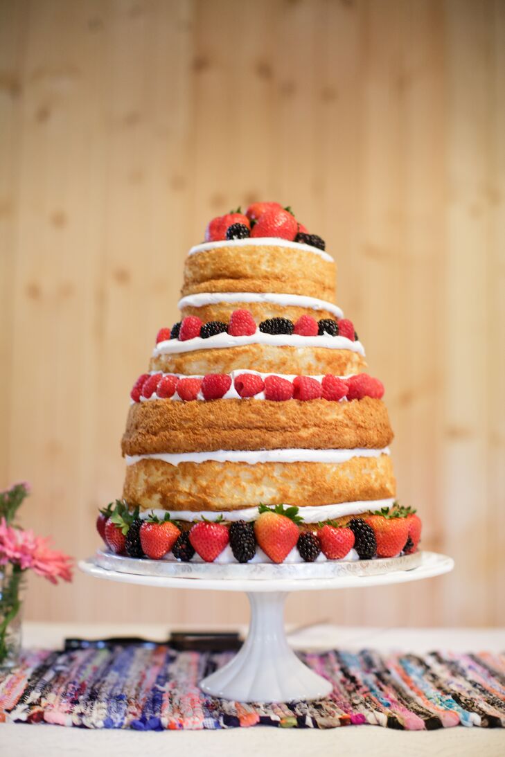 A tiered "naked" wedding cake was decorated with fresh, summer berries.