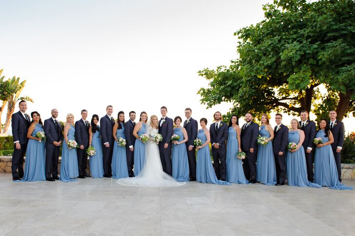"Peter chose a modern-style tuxedo with a slim fit that he knew would look sharp on his groomsmen," the couple says. "Peter wore a classic black bow tie—while the groomsmen wore neckties—and his grandfather's Navy pin."