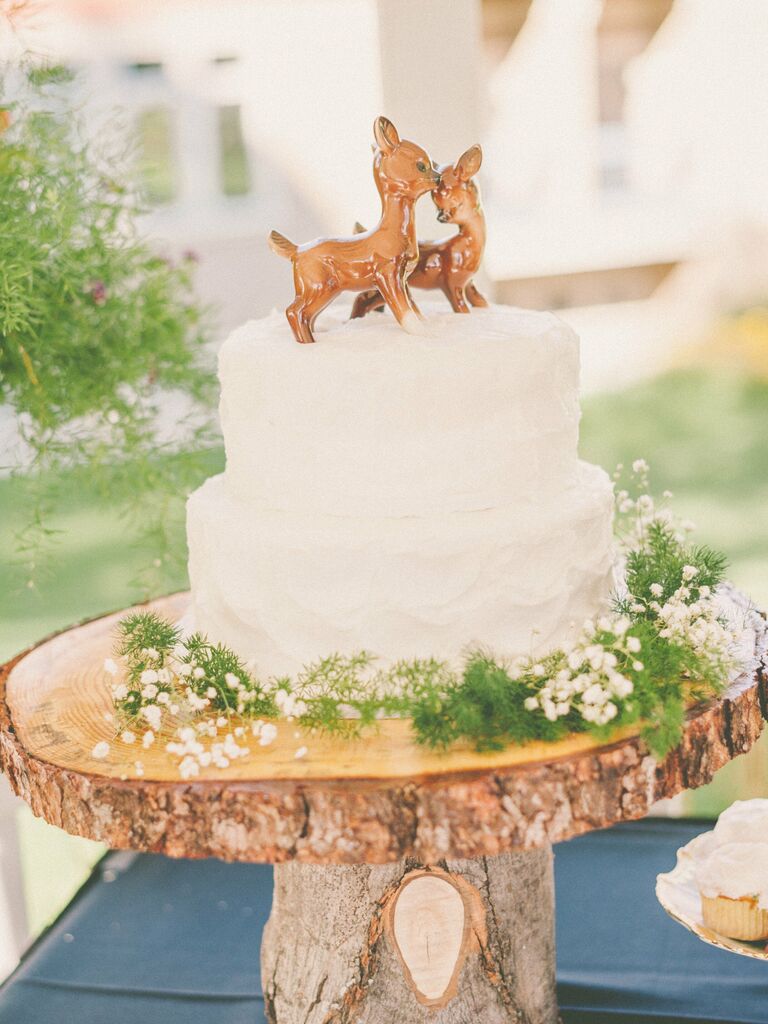 Two porcelain fawn wedding cake toppers. 