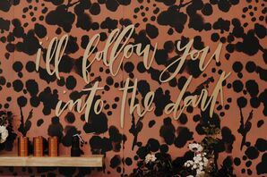 Patterned Black-and-Brown Backdrop With Quote