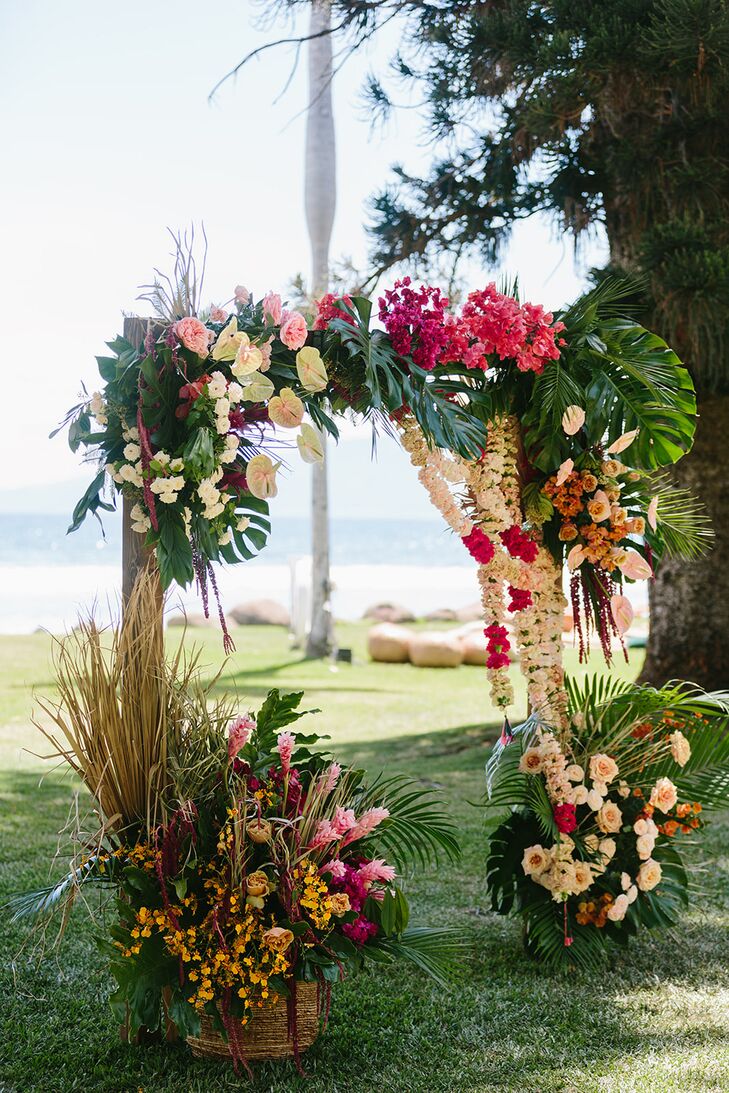 Tropical Ceremony Arch Adorned With Colorful Flowers and Leis in Hawaii