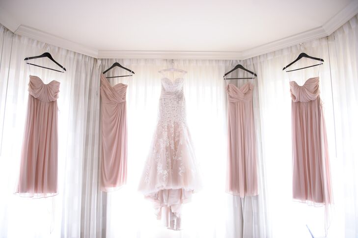 “Once I found the perfect color I told the girls to pick any long style they liked,” Melissa says. Her four bridesmaids wore blush floor-length dresses with empire waists and sweetheart necklines. Each woman matched the pleating on their skirt with either a strapless, one-shoulder or off-the-shoulder style.