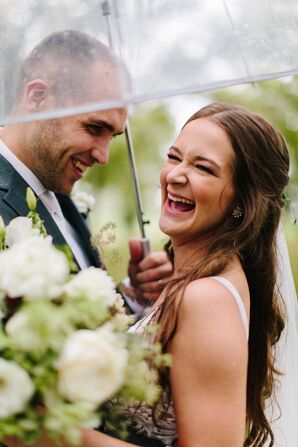 Bride and Groom Underneath Umbrella