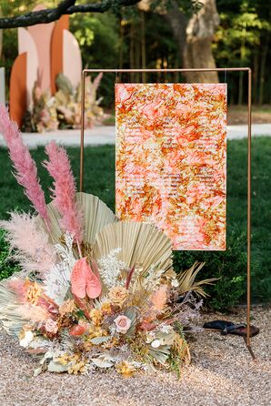 Bohemian Gold-and-Orange Seating Chart with Dramatic Floral Arrangement