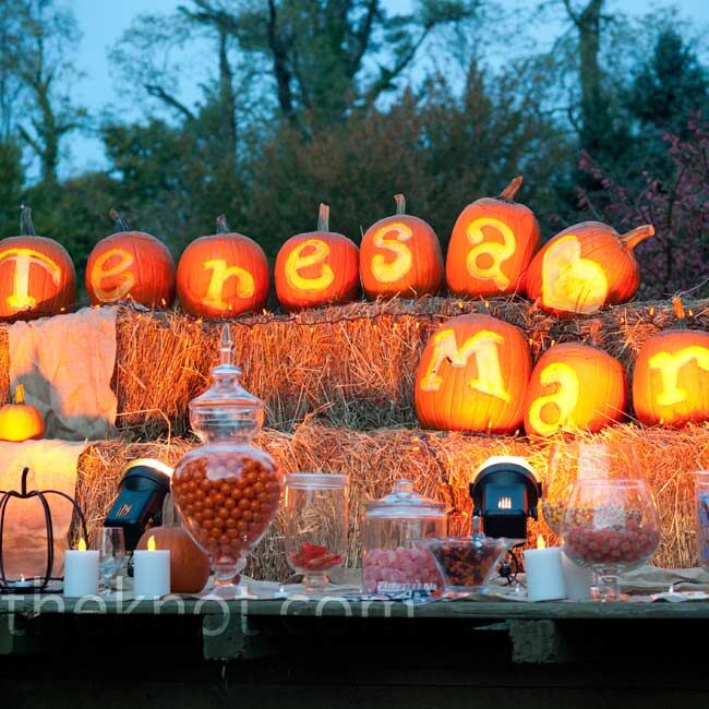 The candy buffet outside the reception tent was decorated with lit-up pumpkins carved to spell out “Teresa [heart] Mark.”
