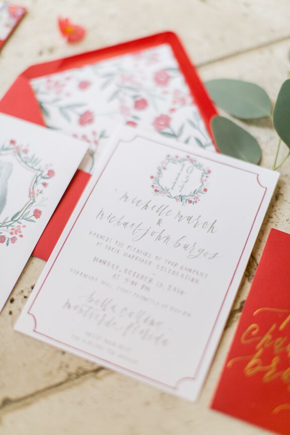 The couple worked with Juliet Grace Design to create a custom  family crest for their invitation suite. Their dog, Joy, was placed at the center, surrounded by the couple’s last name and wedding date. “Joy had the flowers surrounding her. We really used that as the main inspiration for style and colors,” says Michelle.