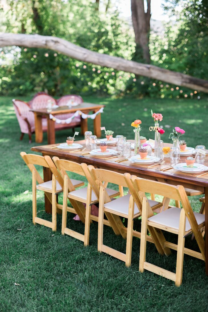 "We set up long rows of harvest tables that were crafted locally. Flowers were placed in clear vases and glassware that I collected from various thrift stores," Devin says.