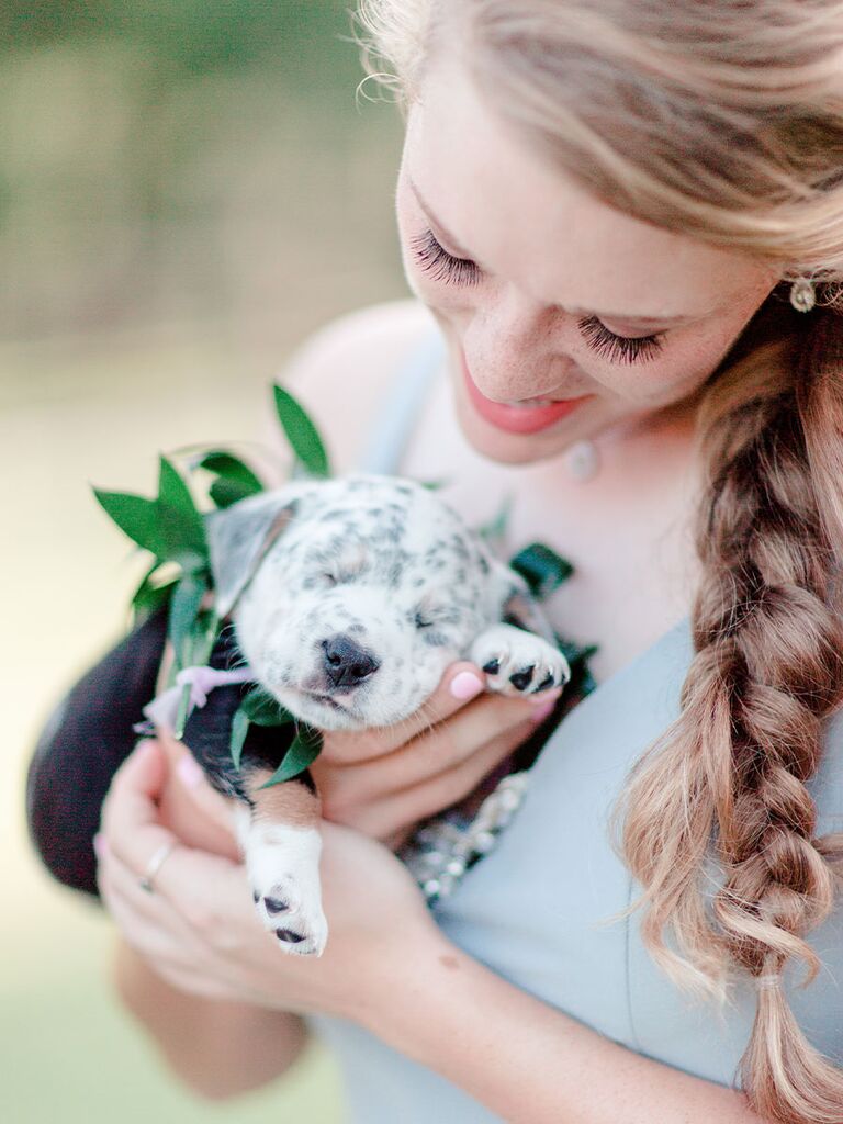 Bridesmaid with cute puppy bouquet