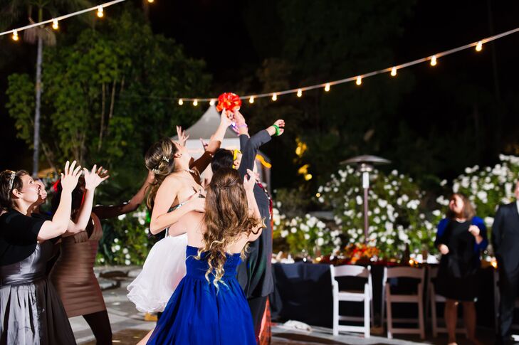 Guests Frantically Reach for the Tossed Bridal Bouquet