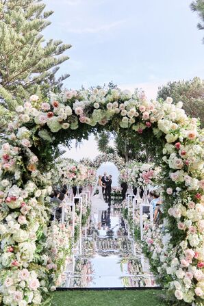 Wedding Ceremony With Mirrored Aisle and Arch With Roses and Hydrangeas