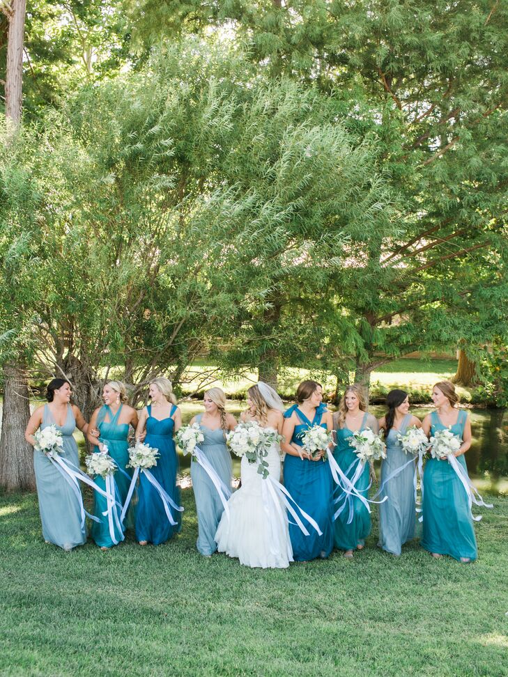 Michelle’s eight bridesmaids donned long flowing Jenny Yoo Annabelle dresses in a variety of styles and shades of blue. “I look back on the pictures and love the variety of colors and shapes of the dresses,” Michelle says.