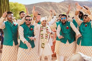 Indian Groom in White Sherwani and Groomsmen in Green and Gold Kurtas