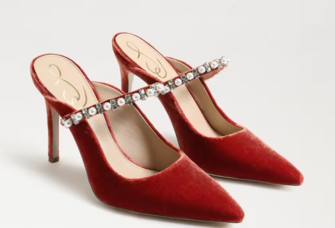 Orange velvet pump-style heel with a bejewled strap. 