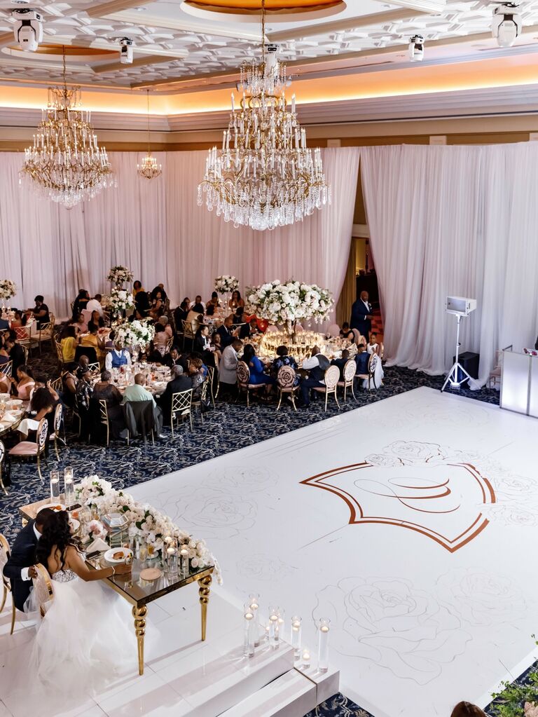 Chic white dance floor embellished with roses. 