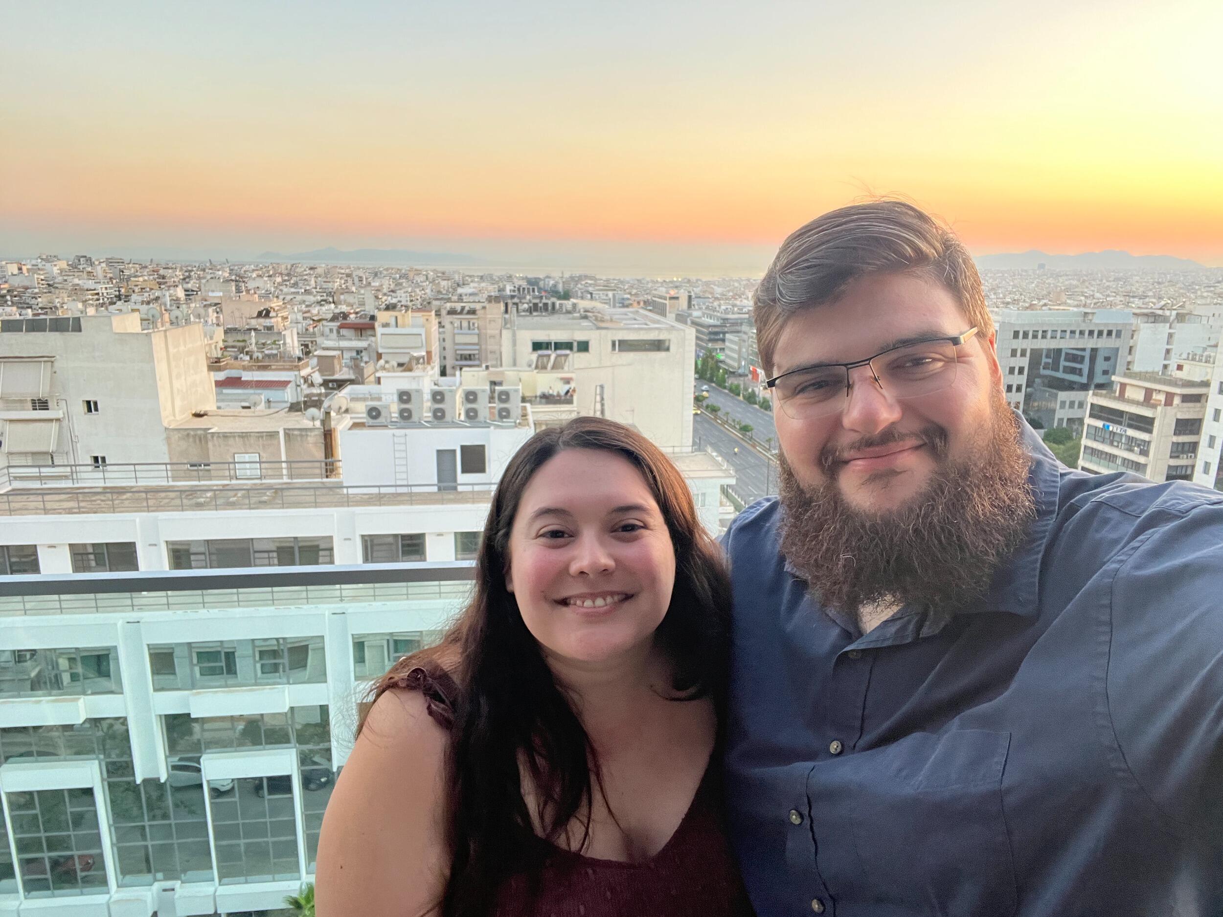 Us on the roof top of our hotel in Athens, Greece 2024 before our Mediterranean cruise.