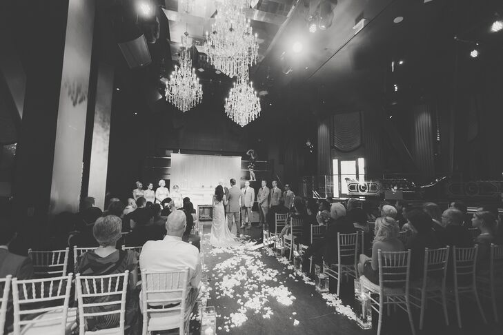 The couple exchanged vows in the nightclub turned reception hall. The decor was kept to a minimum and without the addition of a traditional style altar, creating a relaxed and intimate atmosphere.