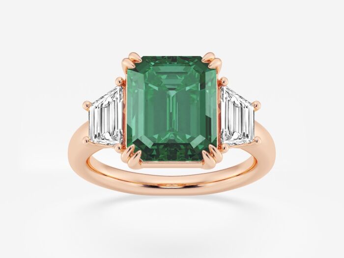 Three stone emerald and diamond engagement ring. 