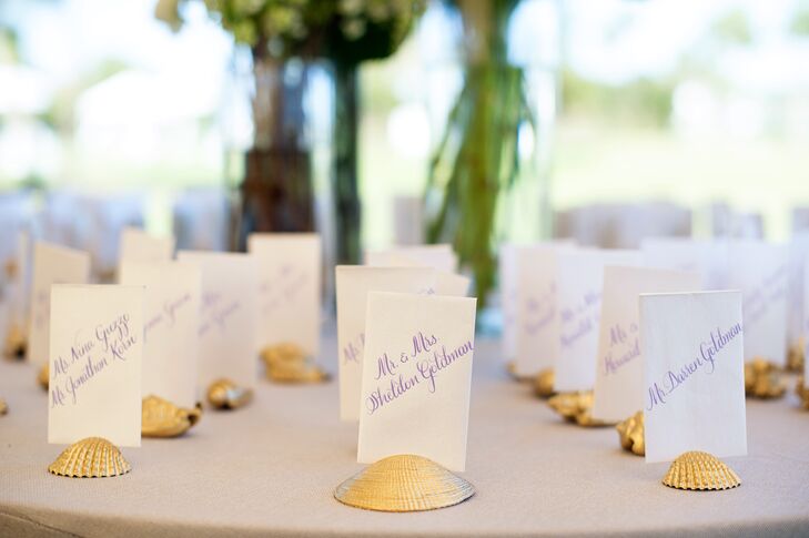 As a nod to the locale, Emily and Jason displayed their escort cards in gilded seashells. “I love watercolors, so we had watercolor artwork by Carly Martin of Clementine Studio integrated into our day-of items,” Emily says.