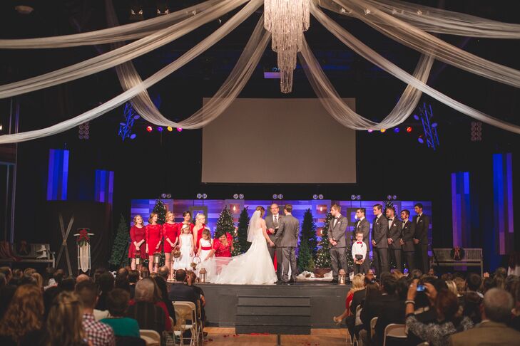 White drapery and a crystal chandelier added a touch of elegance to Elizabeth and Mason's wedding ceremony at Faith Life Church.