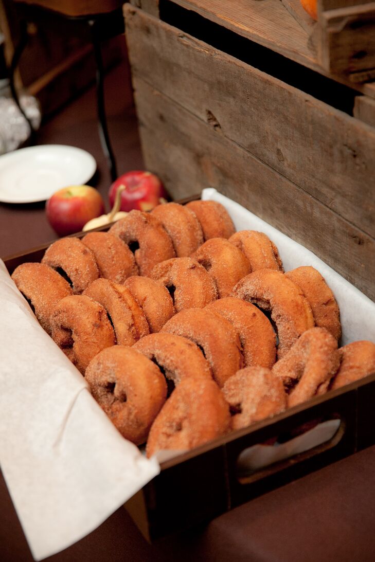 A subtle apple motif—which extended to the apple cinnamon donuts served during dessert—was inspired by Sara and Rob's fall wedding date and Sara's love for all things apple.