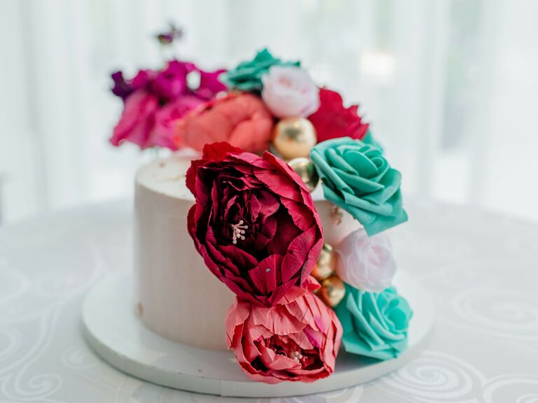 Small tiered cake with floral embellishments. 