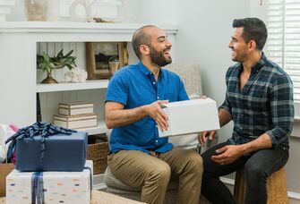 Couple opening trending 2023 wedding registry gifts 