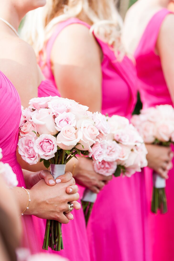 Kelley and Jeff wanted to create bright arrangements that stood out against their mountaintop setting, so they worked with Lee Vazquez Floral Design to make just that. Each bridesmaid carried this sweet arrangement of light pink roses and pink lisianthus that matched their fuchsia dresses.