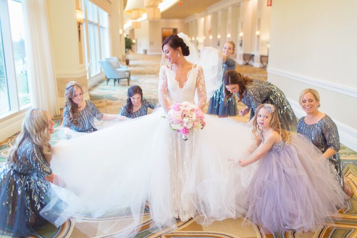 The bridesmaids wore gray, beaded Basixx black couture short cocktail dress with a three-quarter length sleeve, boat neck and flared bottom. “It had an Audrey Hepburn meets Carrie Bradshaw feel,” Shayna says. “That’s what I loved about it.”
