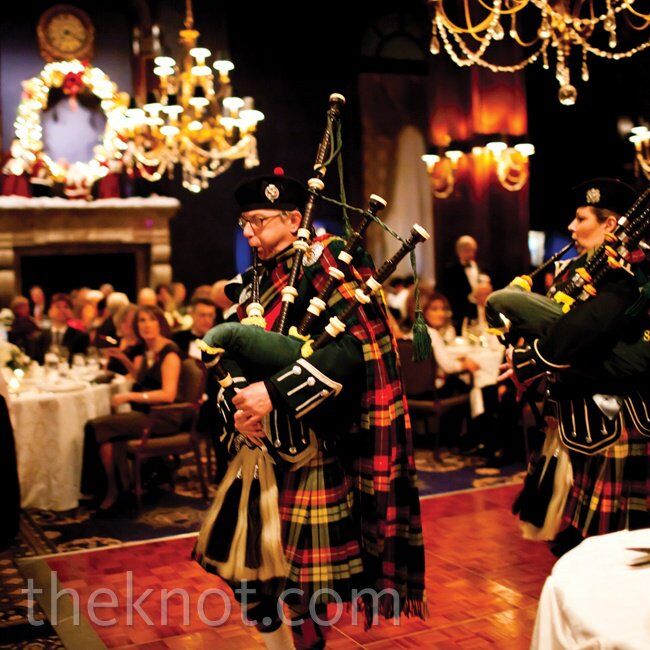 The Union League Club’s fireplaces, warm colors and Christmas decor set the perfect stage for the holiday-themed look. For the big entrance, bagpipers led the couple and the bridal party into the reception.