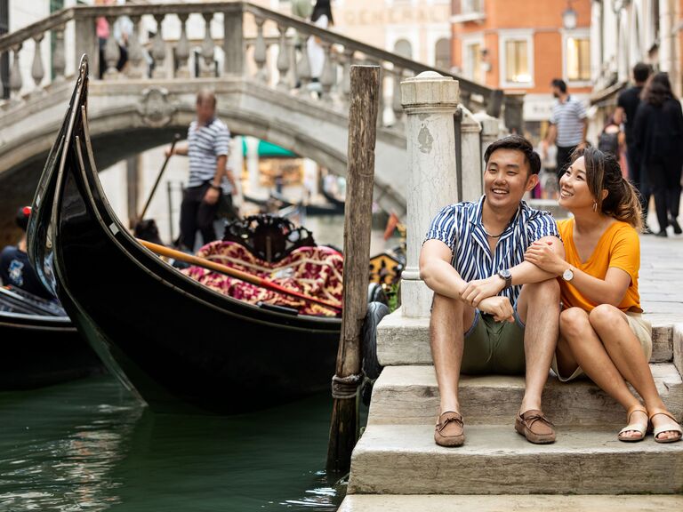 Couple on honeymoon in Italy revenge travel 2023 wedding registry trend
