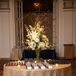 The ornate white and gold interior of Fairmont Copley Plaza in Boston, Massachusetts, played into their theme of timeless elegance. The couple's navy and gold escort cards echoed their invitations.