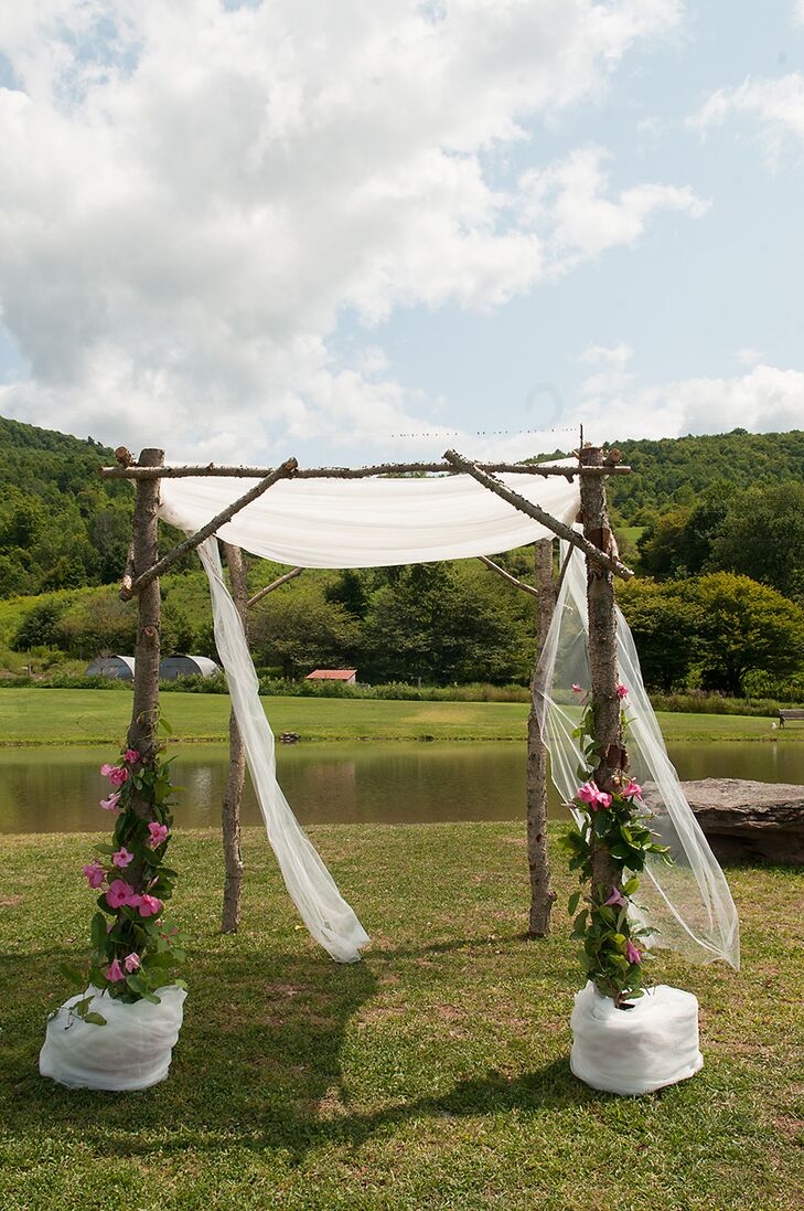 Wooden Ceremony Arch With White Drapery