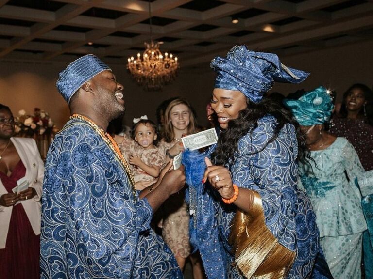 bride and groom participating in money dance
