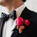 Pink Rose Boutonniere and Black-and-White Polka Dot Bowtie
