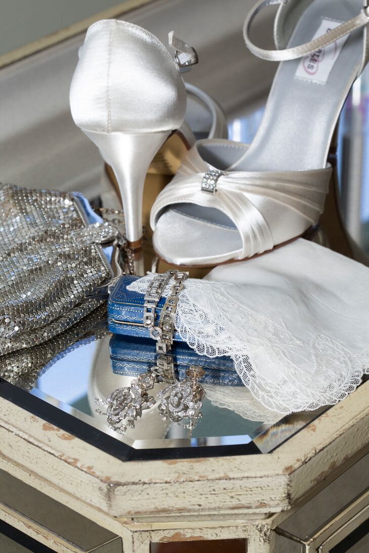 Beth wore silver heels and art deco jewelry borrow from friends. She carried her grandmother's mesh silver purse and lace handkerchief on her wedding day.