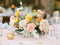 summer wedding centerpiece with yellow and blush roses