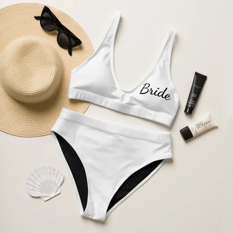 white bikini with high waisted bottoms and 'bride' in black type on top