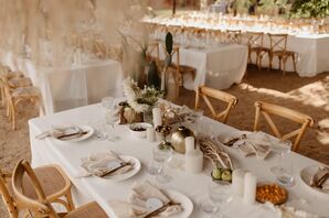 Long Tables on Sand, White Linens With Minimalistic Centerpieces, Candles and Fruit