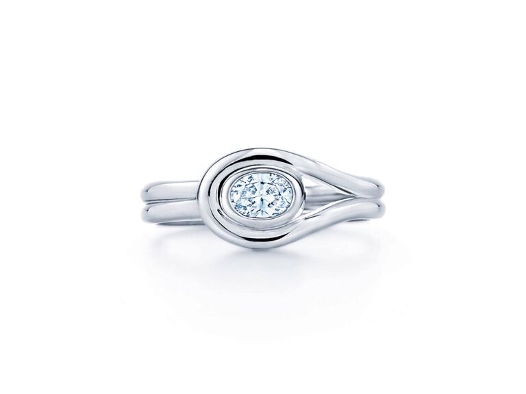 oval diamod ring in swirl setting