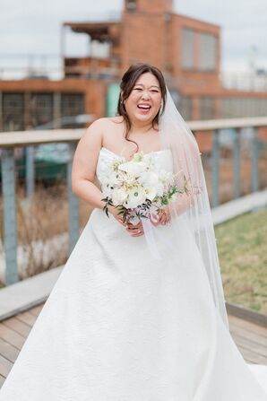 Bride in A-Line Gown and White and Ivory Bouquet With Long Veil With Pearls