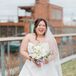 Bride in A-Line Gown and White and Ivory Bouquet With Long Veil With Pearls