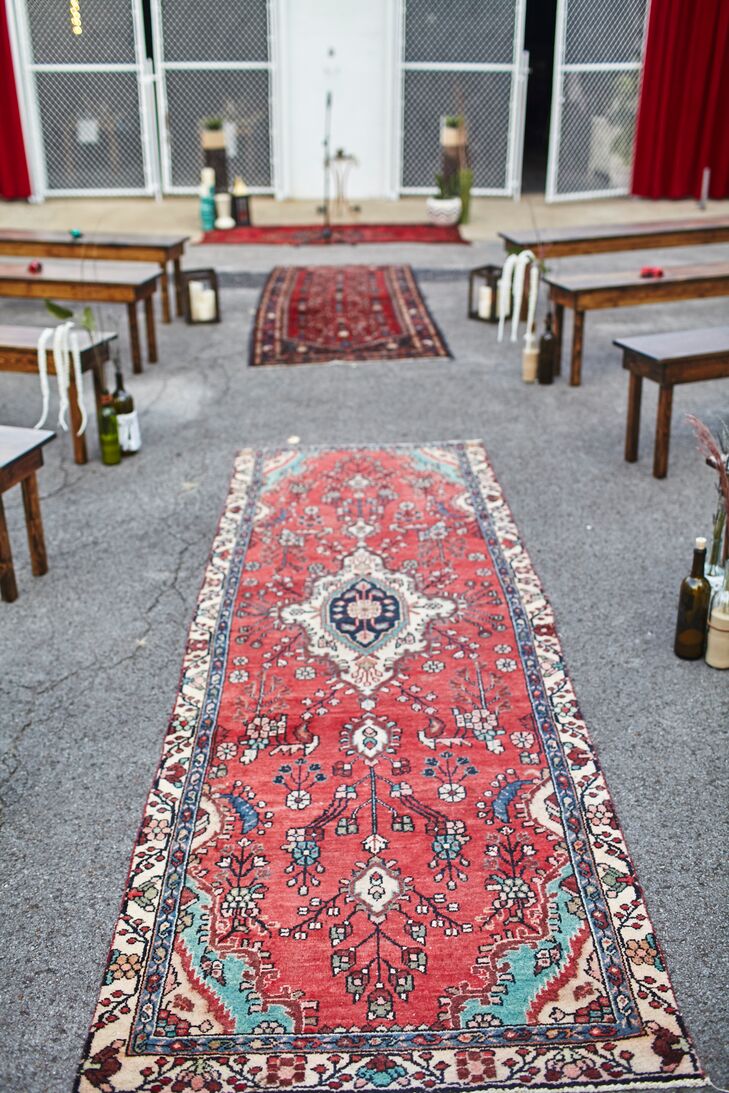 Custom red velvet curtains and Persian rugs lining the aisle added a luxurious touch.