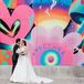 Groom in Suit and Bride in A-Line Gown, Bright Graffiti Wall, Groovy Colors