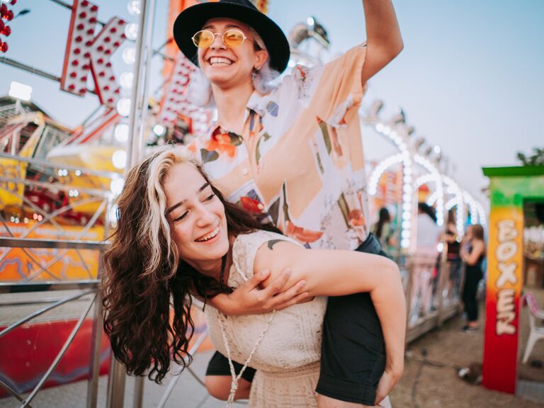 A same-sex couple enjoying a day at the carnival