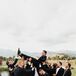 Groomsmen Throwing Groom in Air During Portraits