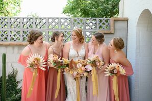 Bridesmaids in Various Shades of Peach and Red for Wedding at Casa Cartel in Austin, Texas