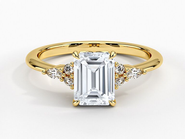 brilliant earth emerald cut diamond engagement ring with claw prongs round and marquise side diamonds and plain yellow gold band