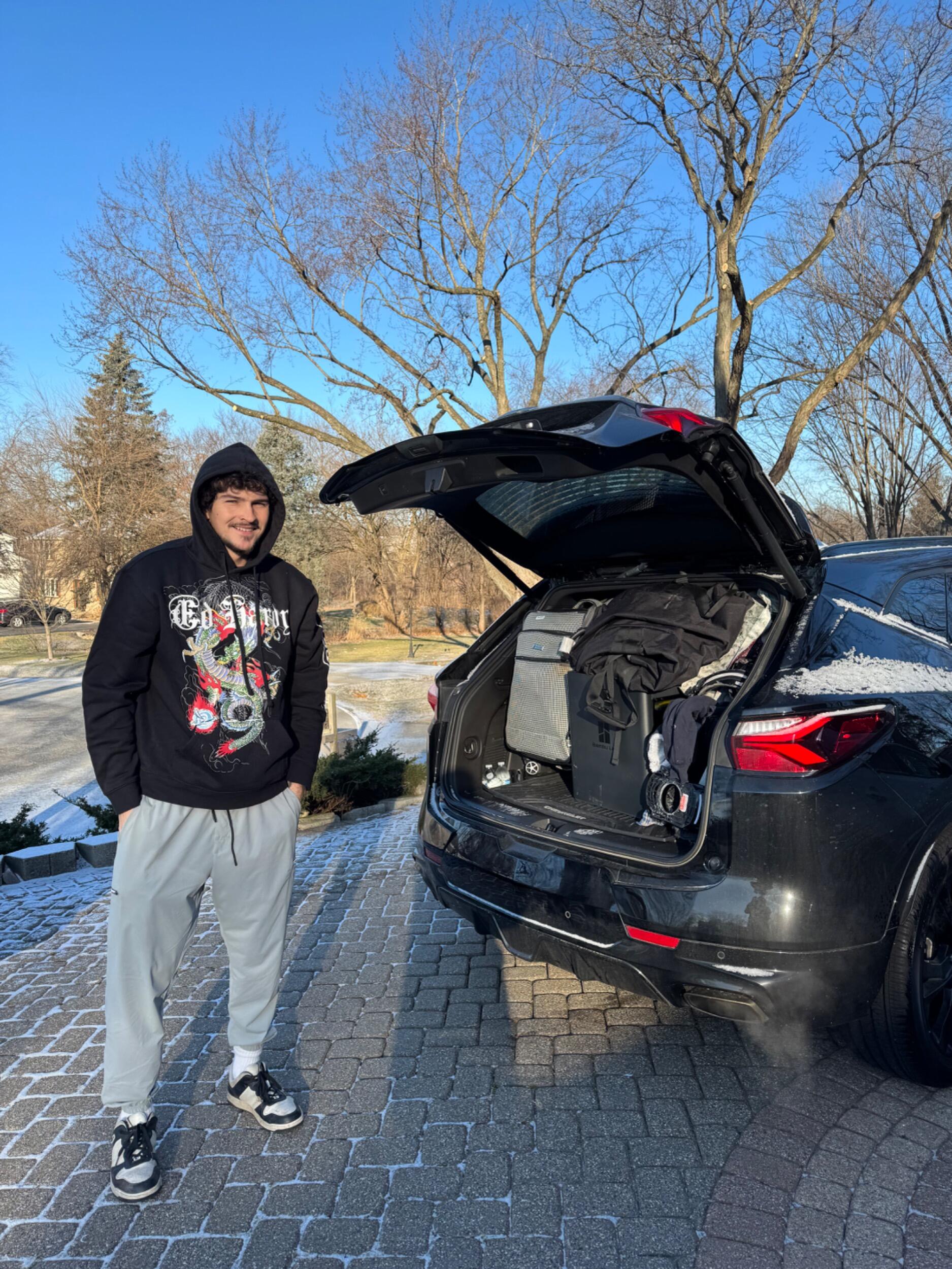 Nico packing up his car to move from Chicago to Colorado.